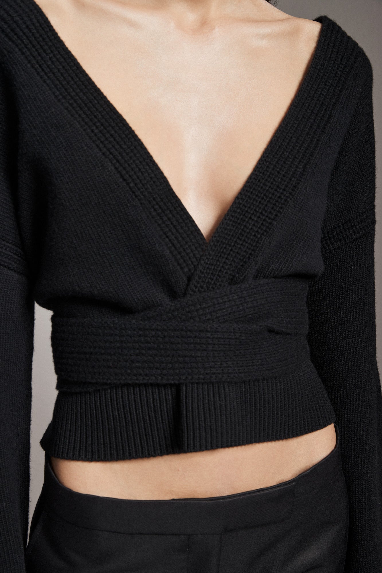 Sweater with deep v-neck and belt