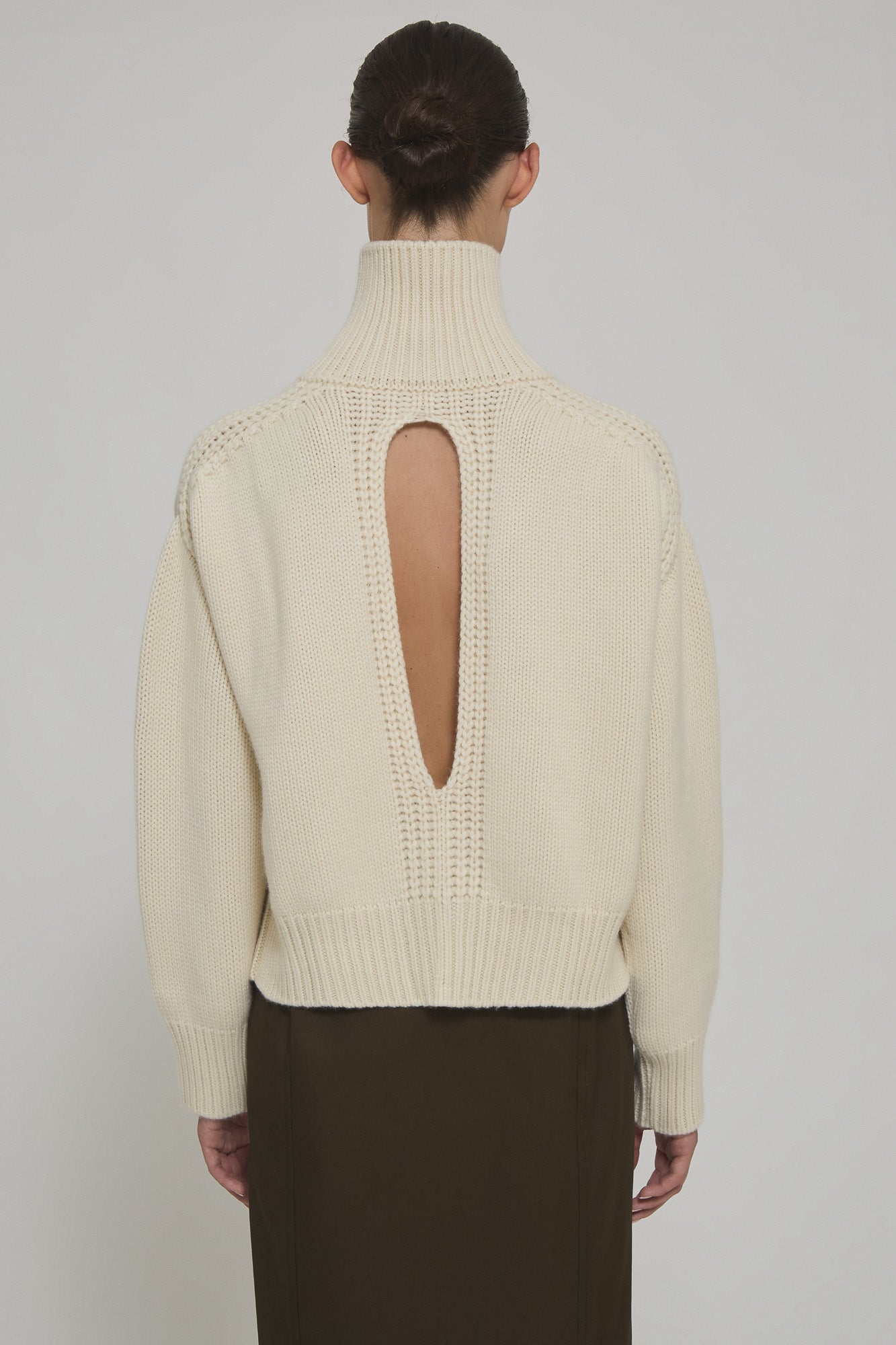 High neck cashmere sweater with back slit